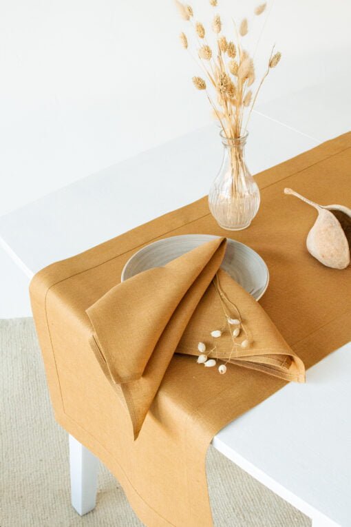 Stonewashed linen napkins in honey yellow color, with simple hem.