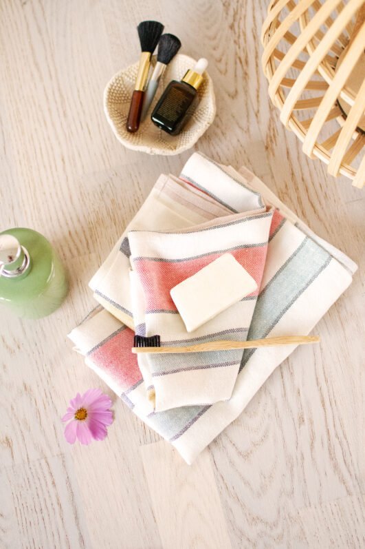 Striped heavy linen towels stipes goes through the towel with different pastel colors.