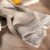 natural linen towels with off white wide lace on one edge.