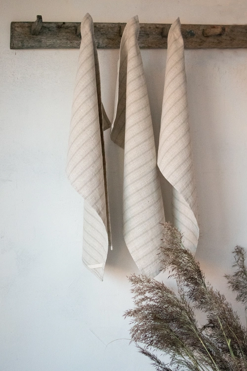 Striped natural linen towels can be used like tea towels in the kitchen, or hand towels in bath