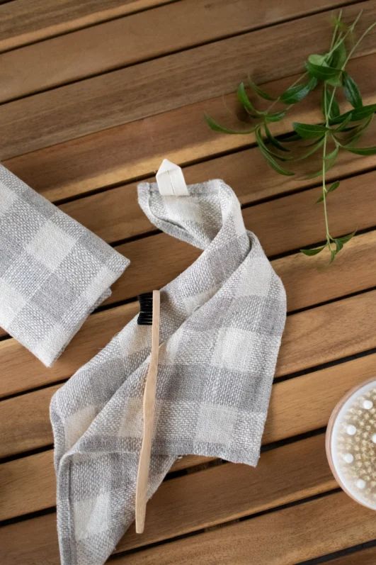 Small rustic heavy linen tartan towel with hanging loop.