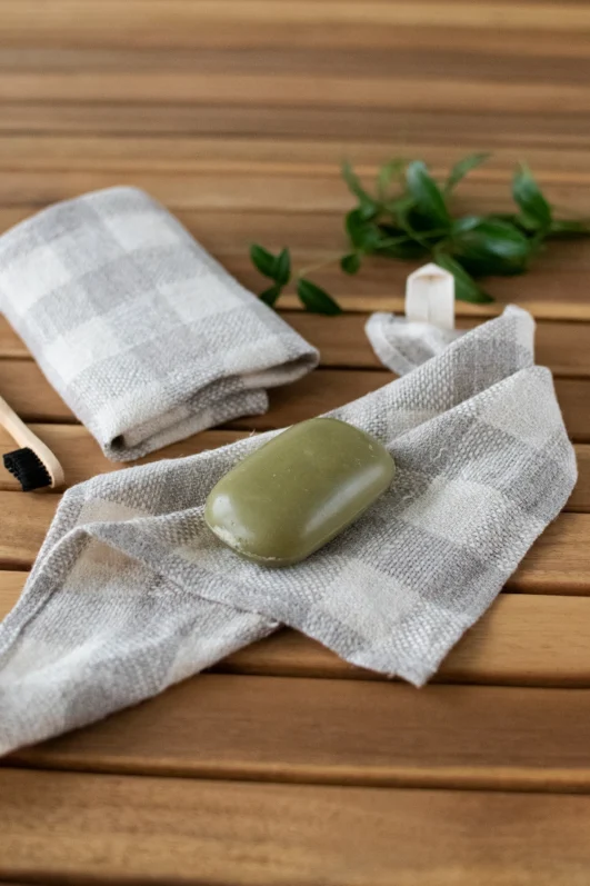 Small rustic heavy linen tartan towel with hanging loop for casual morning face care.