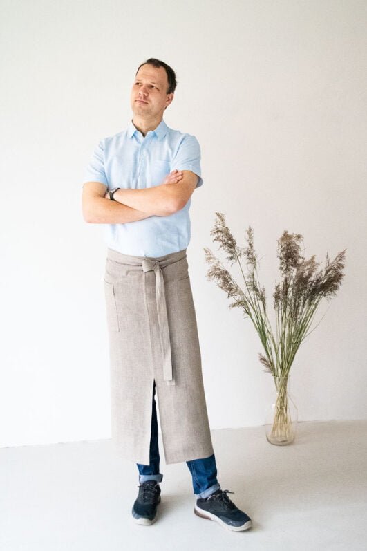 Natural linen long half apron is made with a slit on front and it helps to keep moving comfortable and the apron has the pockets on the sides. The belt is made long enough. Look great as cafe or restaurant apron. The apron can be used mostly in the kitchen, but can be great in the garden.