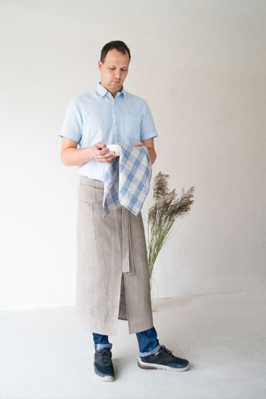 Natural linen long half apron is made with a slit on front and it helps to keep moving comfortable and the apron has the pockets on the sides. The belt is made long enough. Look great as cafe or restaurant apron. The apron can be used mostly in the kitchen, but can be great in the garden.