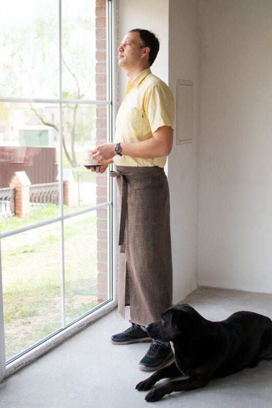 Brown linen long half apron is made with a slit on front and it helps to keep moving comfortable and the apron has the pockets on the sides. The belt is made long enough. Look great as cafe or restaurant apron.