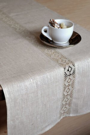 Light natural linen table runner with natural linen lace on the center of the table runner along the runner. Lace transparent and gauzy. Great decor for Your dinner table to special event.