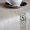 Light natural linen table runner with natural linen lace on the center of the table runner along the runner. Lace transparent and gauzy. Great decor for Your dinner table to special event.