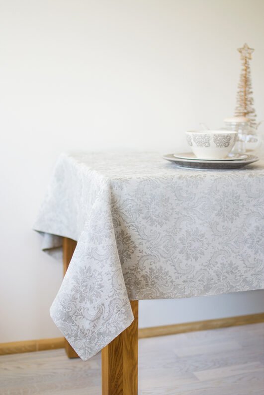 Natural white damask linen tablecloth with mitered corners. Luxury damask pattern looks perfect for special family occasion.