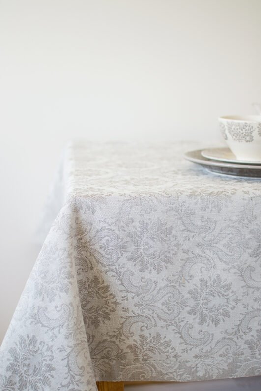 Natural white damask linen tablecloth with mitered corners. Luxury damask pattern looks perfect for special family occasion.