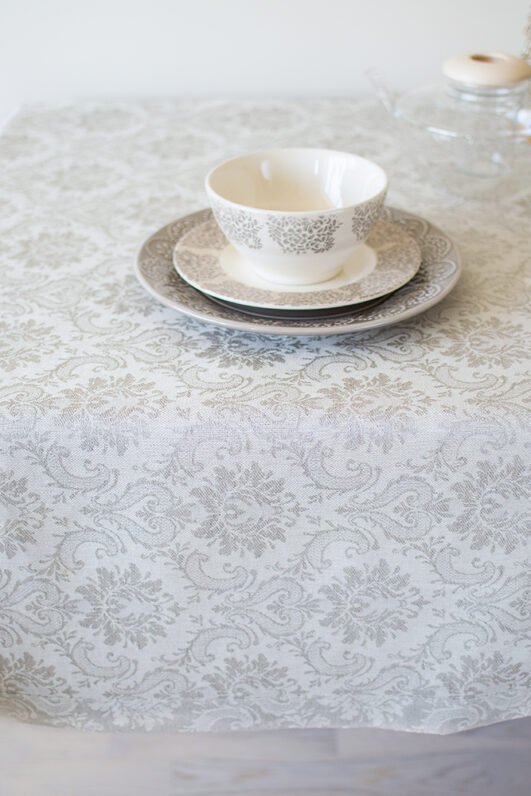 Natural white damask linen tablecloth with mitered corners. Luxury damask pattern looks perfect for special family occasion.