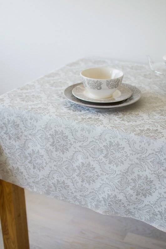 Natural white damask linen tablecloth with mitered corners. Luxury damask pattern looks perfect for special family occasion.