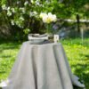 Light natural round linen tablecloth on small table goes to the ground in so wonderful deep folds. This circle linen tablecloth layers on the ground looks so luxury. It is so elegant for Your party with family and friends.
