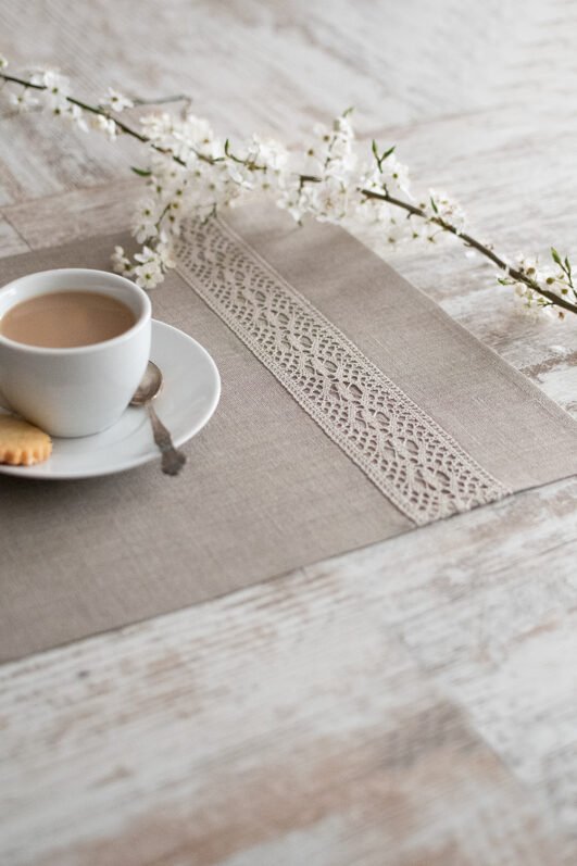 Natural linen placemats with natural lace on one side, rustic farmhouse style for breakfast or brunch with friends.