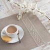 Natural linen placemats with natural lace on one side, rustic farmhouse style for breakfast or brunch with friends.