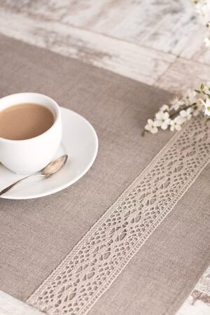 Natural linen placemats with natural lace on one side, rustic farmhouse style for breakfast or brunch with friends.