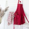 Bordeaux adjustable linen full apron with one pocket on the front. The apron has long belt adjustable by the figure.