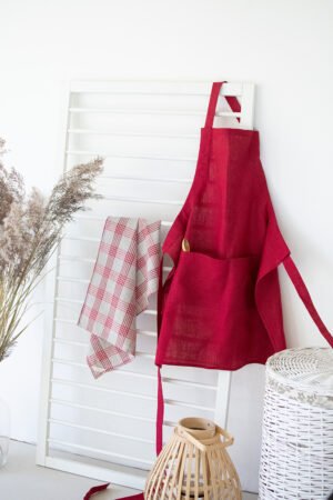 Bordeaux adjustable linen full apron with one pocket on the front. The apron has long belt adjustable by the figure.