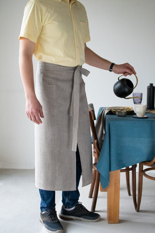 Natural linen long half apron is made with a slit on front and it helps to keep moving comfortable and the apron has the pockets on the sides. The belt is made long enough. Look great as cafe or restaurant apron. The apron can be used mostly in the kitchen, but can be great in the garden.
