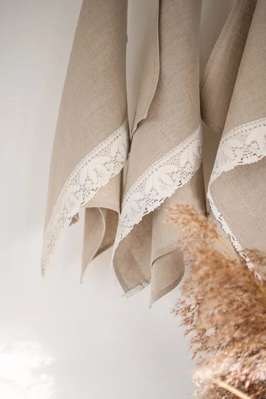 Shabby chic natural linen towels decorated with white luxury wide linen lace with lotus flowers. So great to decor bathroom.