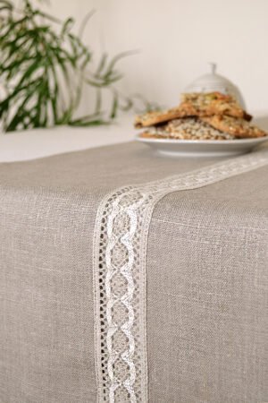 Natural linen table runner with the narrow white with natural linen lace on the center.