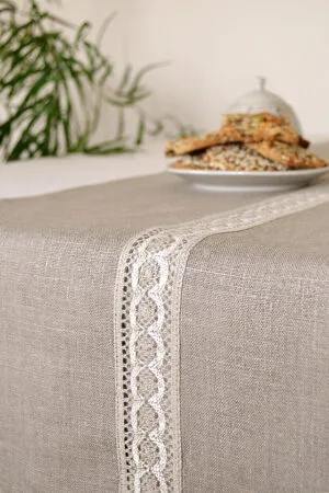 Natural linen table runner with the narrow white with natural linen lace on the center.