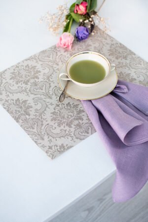 Damask linen placemats with mitered corners. Damak's pattern is woven from linen and cotton in natural shades. And easaly can be combined with our lavender napkins.