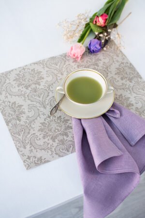 Damask linen placemats with mitered corners. Damak's pattern is woven from linen and cotton in natural shades. And easaly can be combined with our lavender napkins.