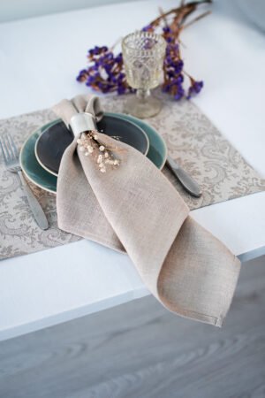 Damask linen placemats with mitered corners. Damak's pattern is woven from linen and cotton in natural shades. And easaly can be combined with our natural linen napkins.