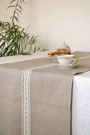 Natural linen table runner with the narrow white with natural linen lace on the center.