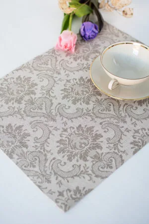 Damask linen placemats with mitered corners. Damak's pattern is woven from linen and cotton in natural shades.