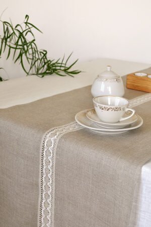 Natural linen table runner with the narrow white with natural linen lace on the center.