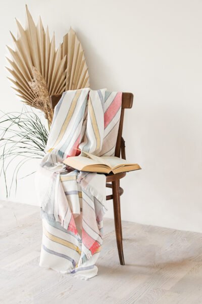 Off white linen blanket with stripes of colors soft and cozy for the couch covering or just use as sofa throw blanket. Blanket two edges are with fringes.