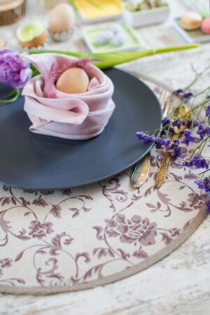 Reversible round linen cotton placemat showing both the Marsala floral side and the natural linen side with finished binding.